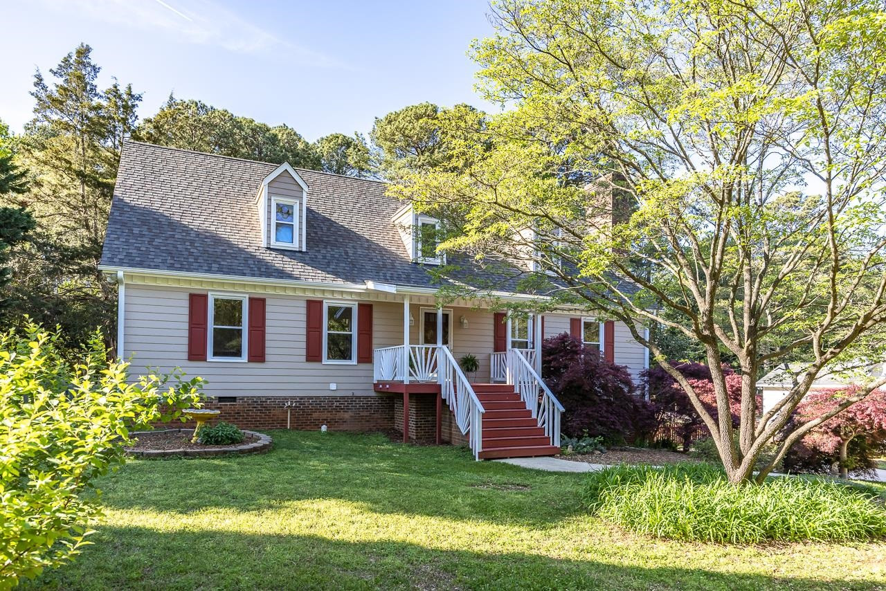 6345 Wynbrook Way Raleigh, NC 27612 - Photo 4 of 40 a view of a house with a yard porch and sitting area