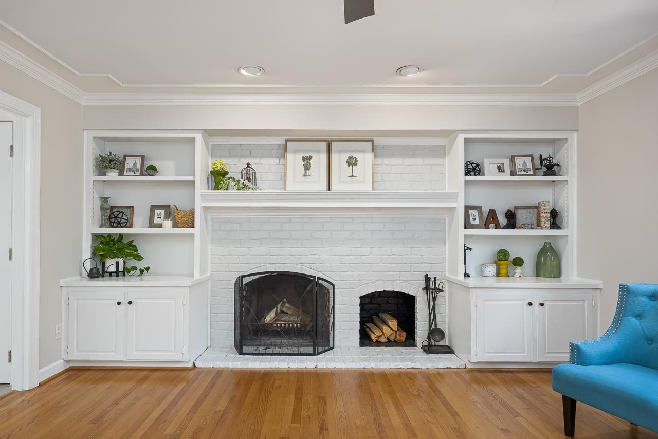 6345 Wynbrook Way Raleigh, NC 27612 - Photo 10 of 40 a living room with fireplace and a wooden floor