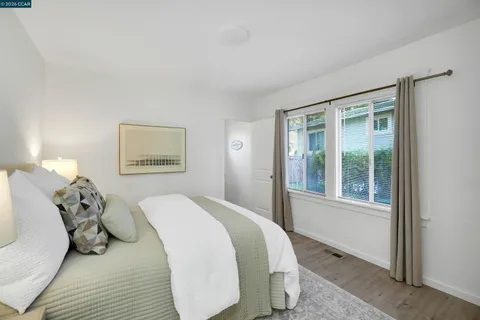 a bed room with a bed and a window