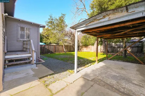 a view of backyard with cabin