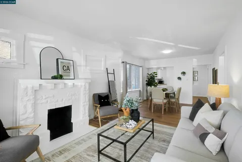 a living room with furniture fireplace and a fireplace