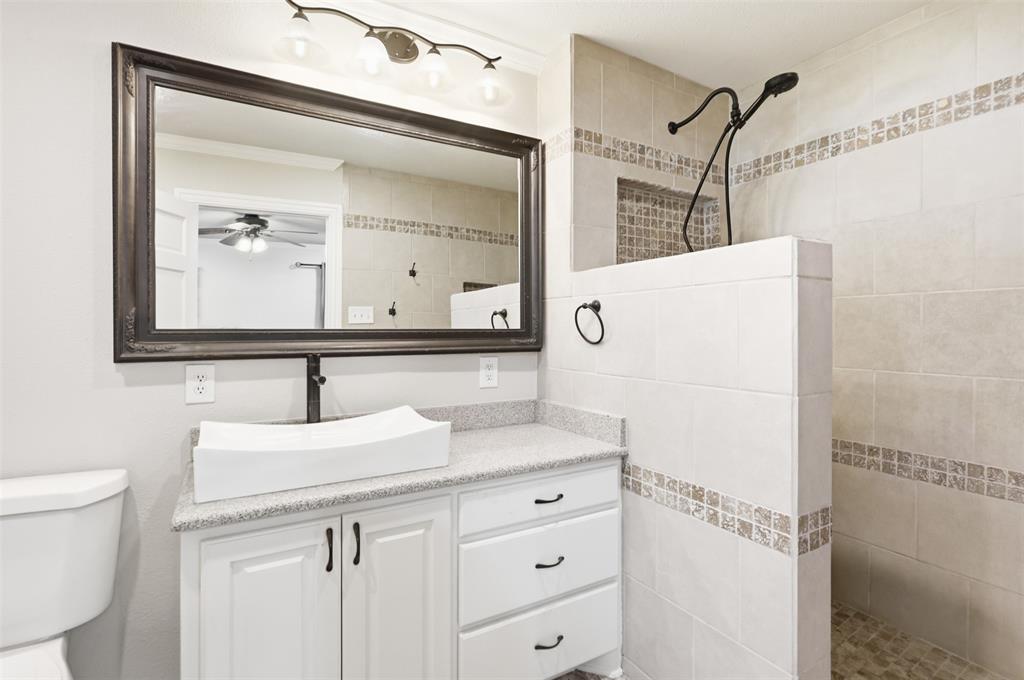 103 Paint Brush Road Lakeside, TX 76108 - Photo 14 of 24 a bathroom with a sink and a mirror