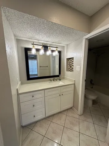 a bathroom with a shower and a bath tub