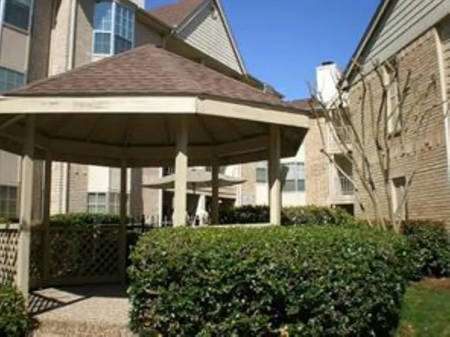 a view of a house with swimming pool and garden