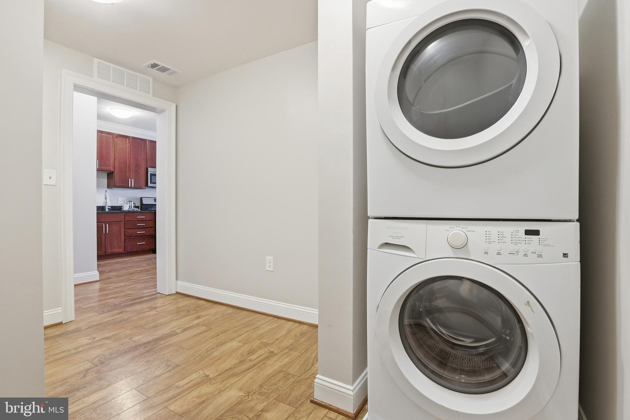 6301 Edsall Road, Unit 106 Alexandria, VA 22312 - Photo 10 of 28 a view of a hallway with washer and dryer