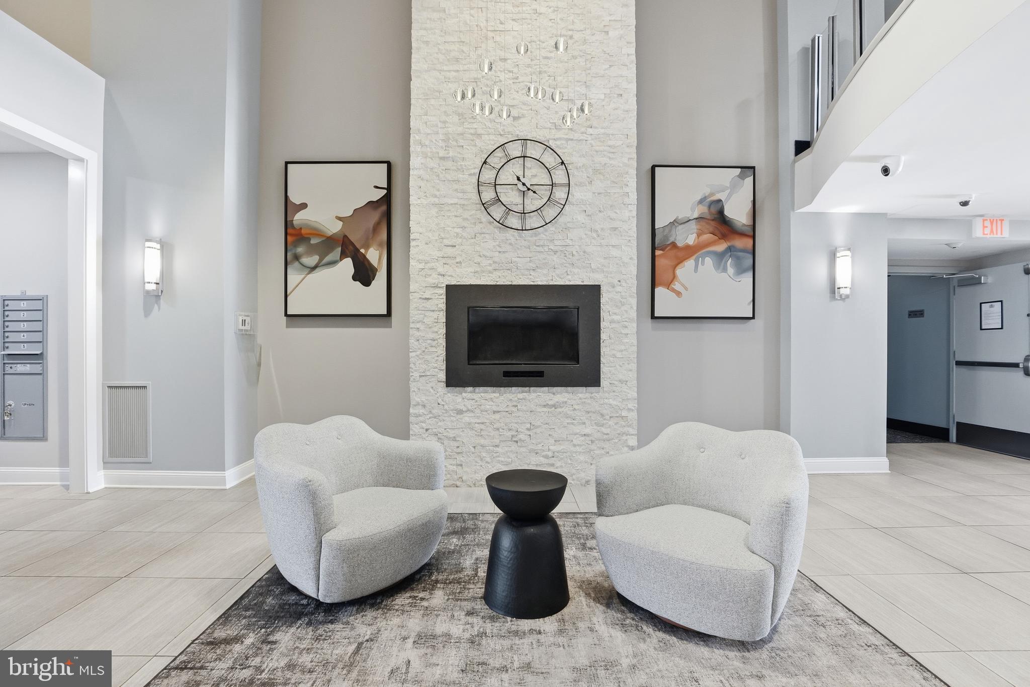 6301 Edsall Road, Unit 106 Alexandria, VA 22312 - Photo 16 of 28 a living room with furniture a rug and a fireplace