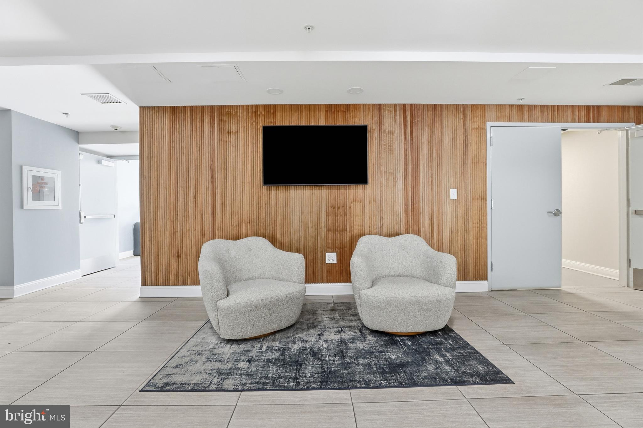 6301 Edsall Road, Unit 106 Alexandria, VA 22312 - Photo 17 of 28 a living room with furniture and a flat screen tv