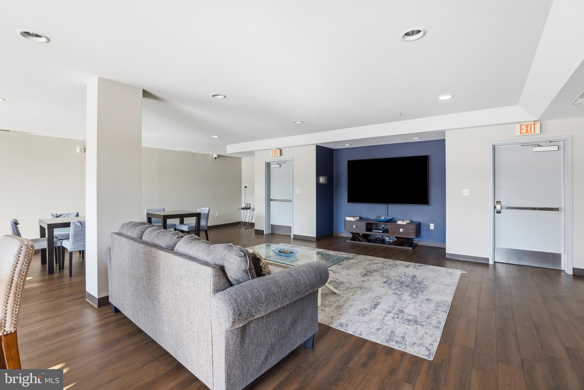 6301 Edsall Road, Unit 106 Alexandria, VA 22312 - Photo 22 of 28 a living room with furniture and a flat screen tv