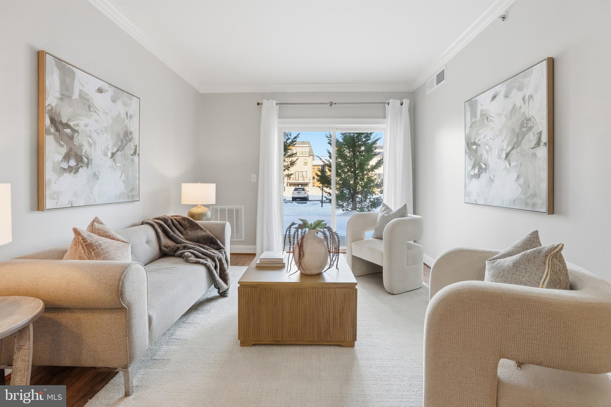 6301 Edsall Road, Unit 106 Alexandria, VA 22312 - Photo 4 of 28 a living room with furniture and a large window