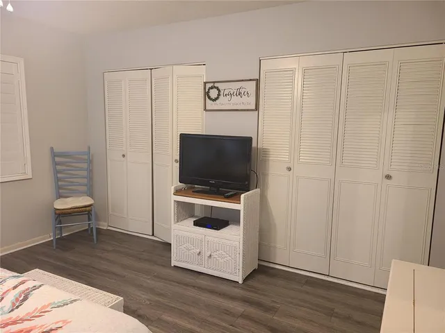 a living room with a flat screen tv and a couch