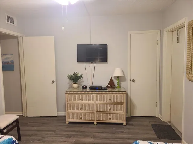 a room with furniture and flat screen tv