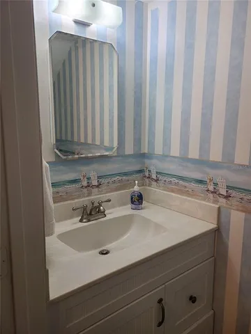 a view of a sink and a mirror