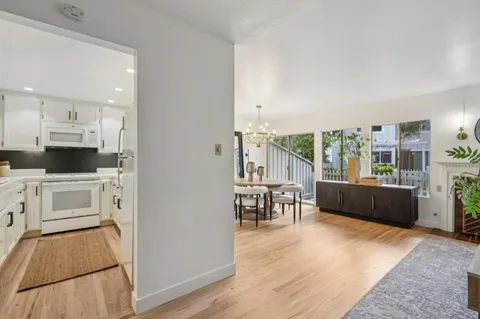 a kitchen with a sink cabinets and window