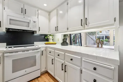 a kitchen with a sink and a refrigerator