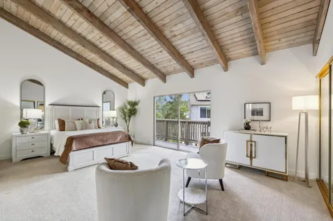 a balcony with wooden floor and outdoor space