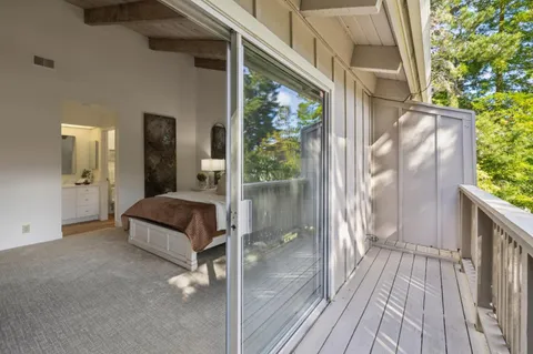 a bed room with a bed and a window