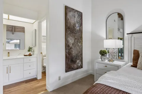 a bedroom with furniture and a window
