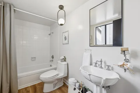 a front view of a house with plants