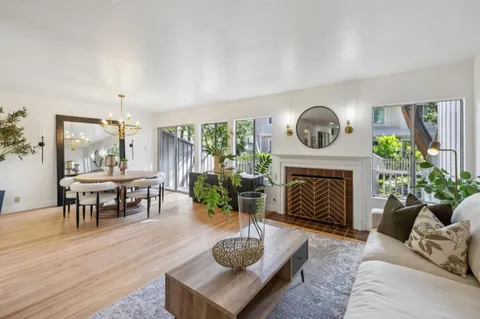 a dining room with furniture a livingroom and chandelier