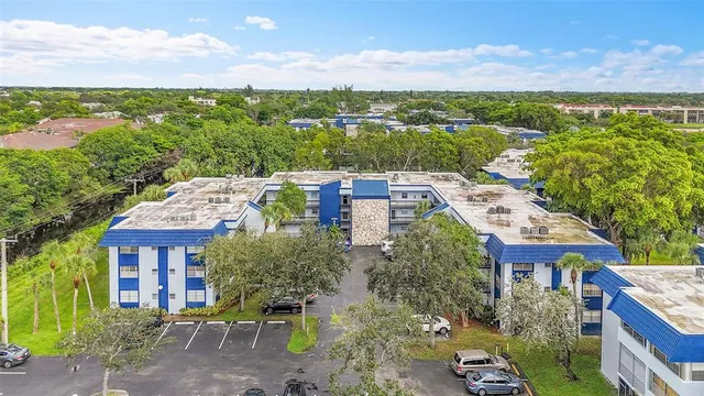 a aerial view of a house with a yard