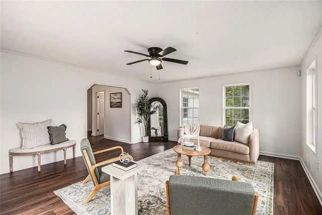 a living room with furniture and a window