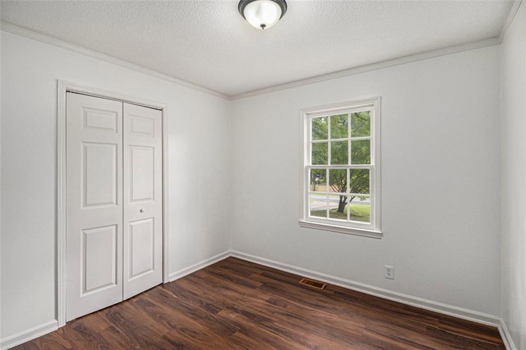 133 North Bellview Road Aragon, GA 30104 - Photo 12 of 22 an empty room with wooden floor and windows