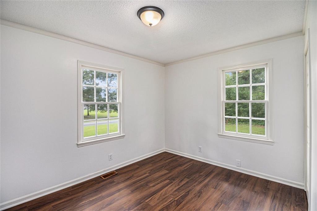 133 North Bellview Road Aragon, GA 30104 - Photo 13 of 22 an empty room with wooden floor and windows