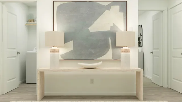 a view of kitchen with stainless steel appliances granite countertop cabinets and wooden floor