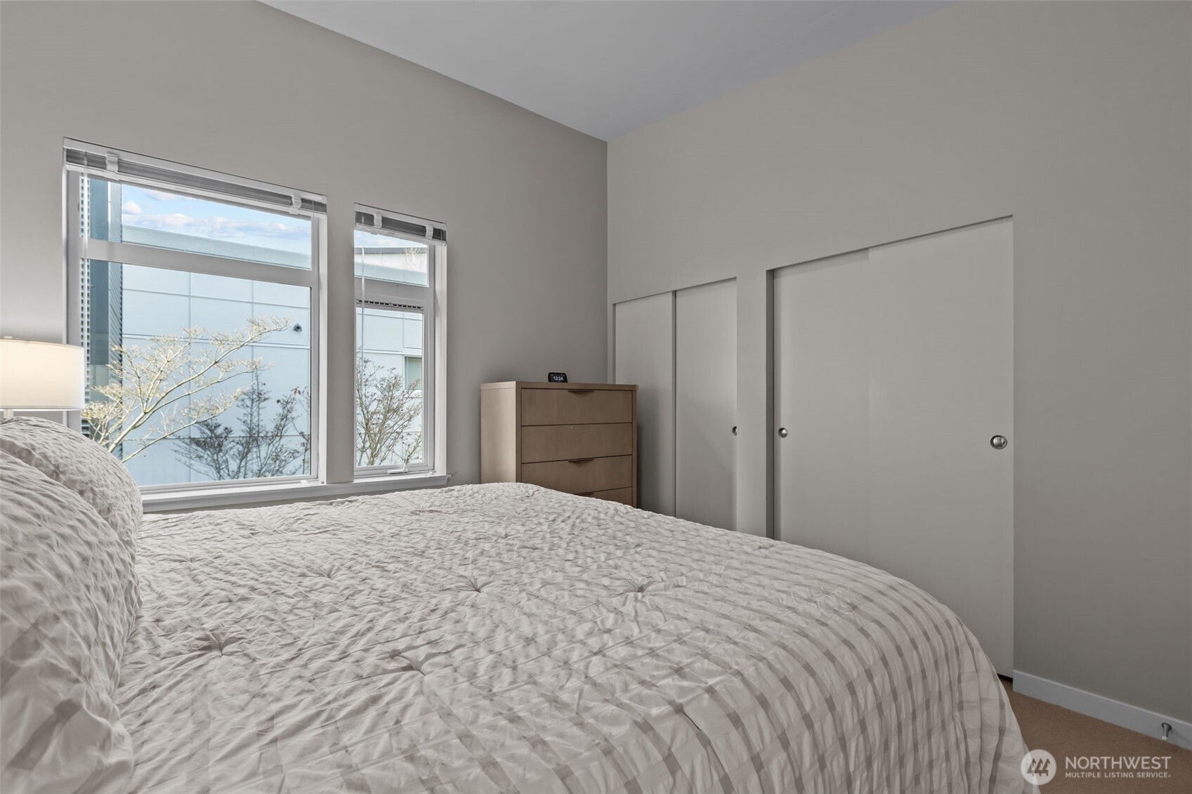 15100 6th Avenue Southwest, Unit 305 Burien, WA 98166 - Photo 24 of 40 a bedroom with a large bed and a window