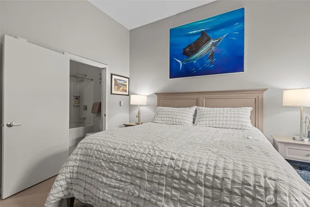 a bedroom with a bed and cupboard