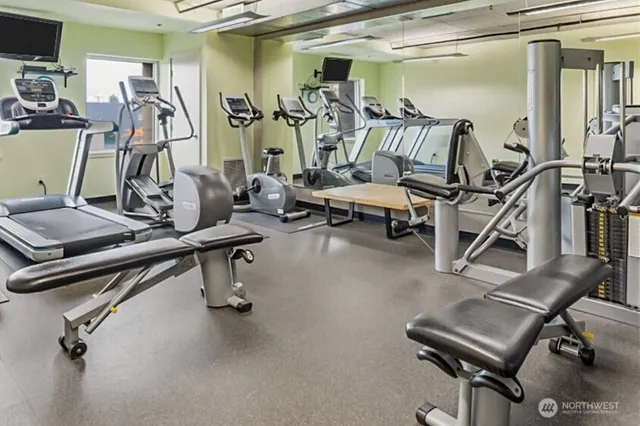 a living room with furniture and a rug