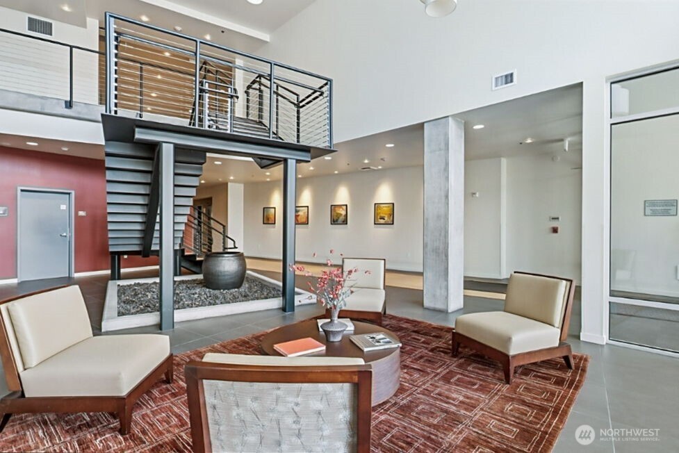15100 6th Avenue Southwest, Unit 305 Burien, WA 98166 - Photo 39 of 40 a living room with furniture and a rug