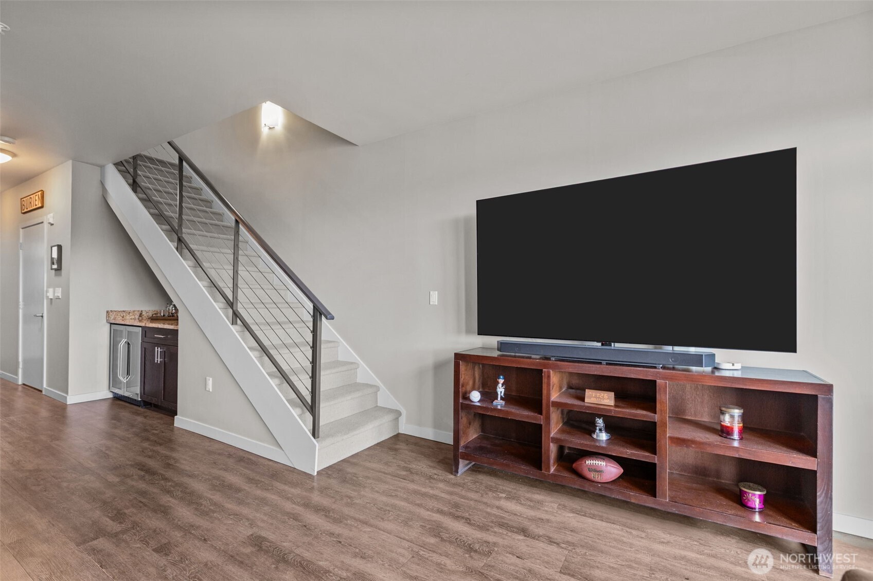 15100 6th Avenue Southwest, Unit 305 Burien, WA 98166 - Photo 4 of 40 a living room with furniture and a flat screen tv
