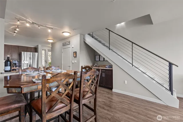 a view of a dining room with furniture and wooden floor