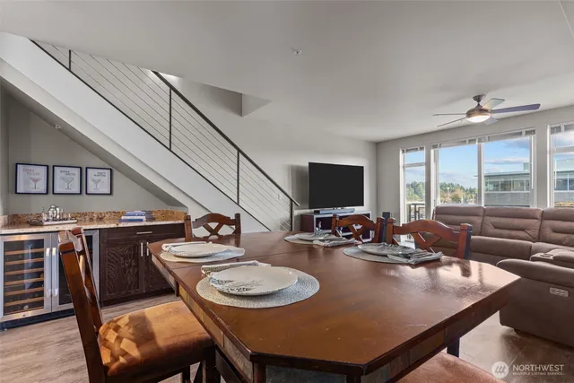 a view of a dining room with furniture window and wooden floor