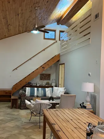 a kitchen with stainless steel appliances granite countertop a stove refrigerator and cabinets