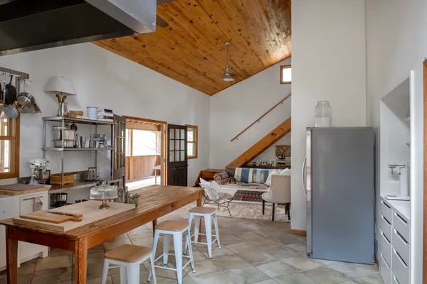 a kitchen with a stove and a refrigerator