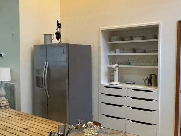 a view of walk in closet with empty racks