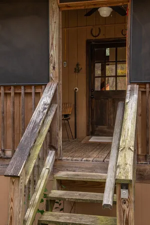 a view of living room kitchen and entryway