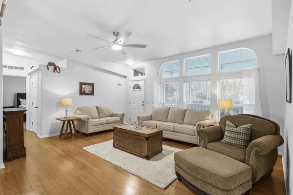 a living room with furniture and a large window