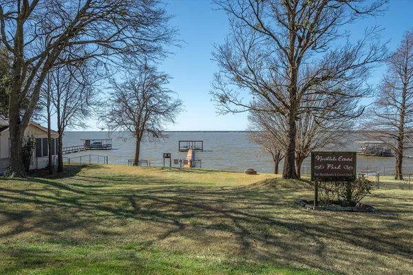 a big house with trees in front of it
