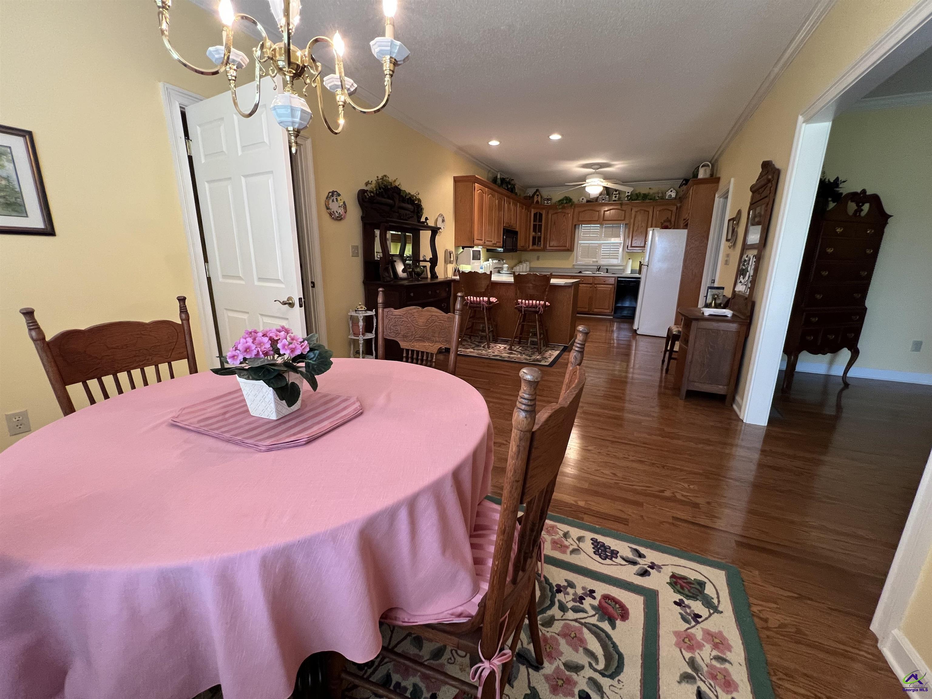 762 Nicholson-Carr Road Chester, GA 31012 - Photo 9 of 81 a dining room with furniture and wooden floor