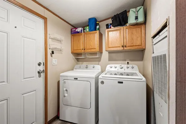 a utility room with dryer and washer