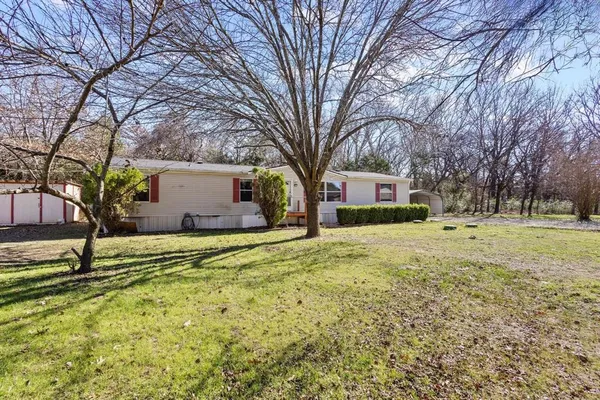 a house with trees in front of it
