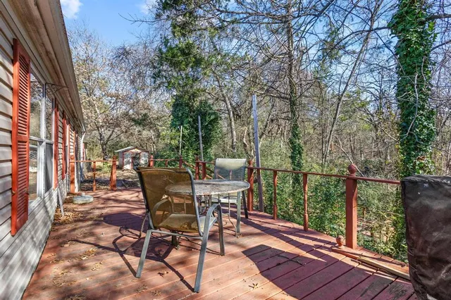 a view of a chairs and table on the wooden floor