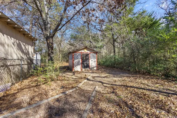 a view of a yard with a tree