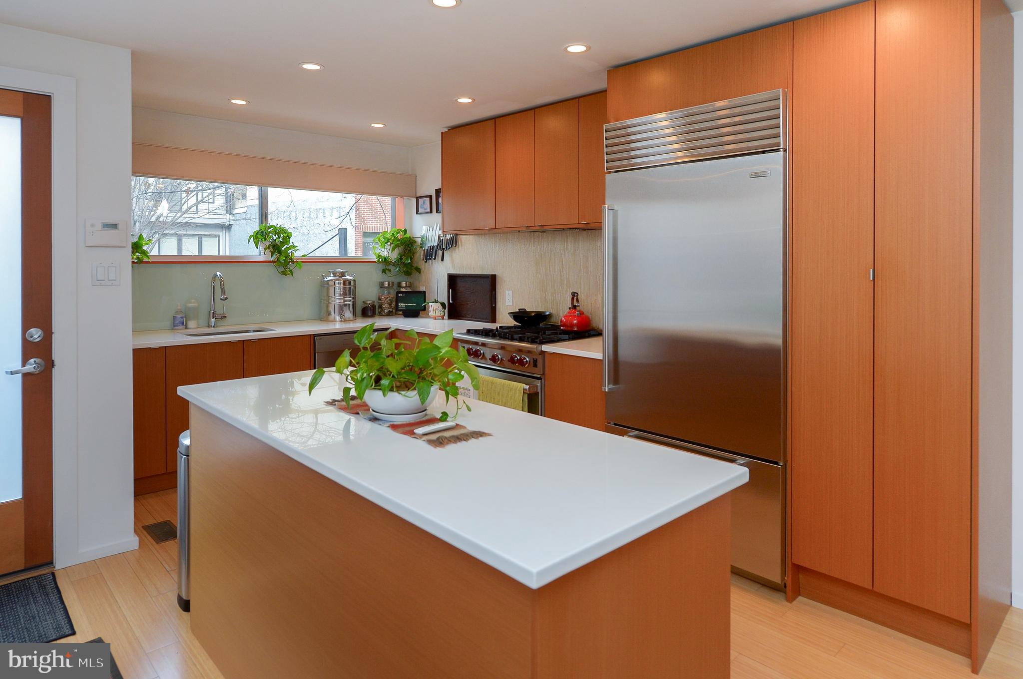 1119 North 3rd Street Philadelphia, PA 19123 - Photo 11 of 46 a kitchen with stainless steel appliances granite countertop a sink a refrigerator and a stove