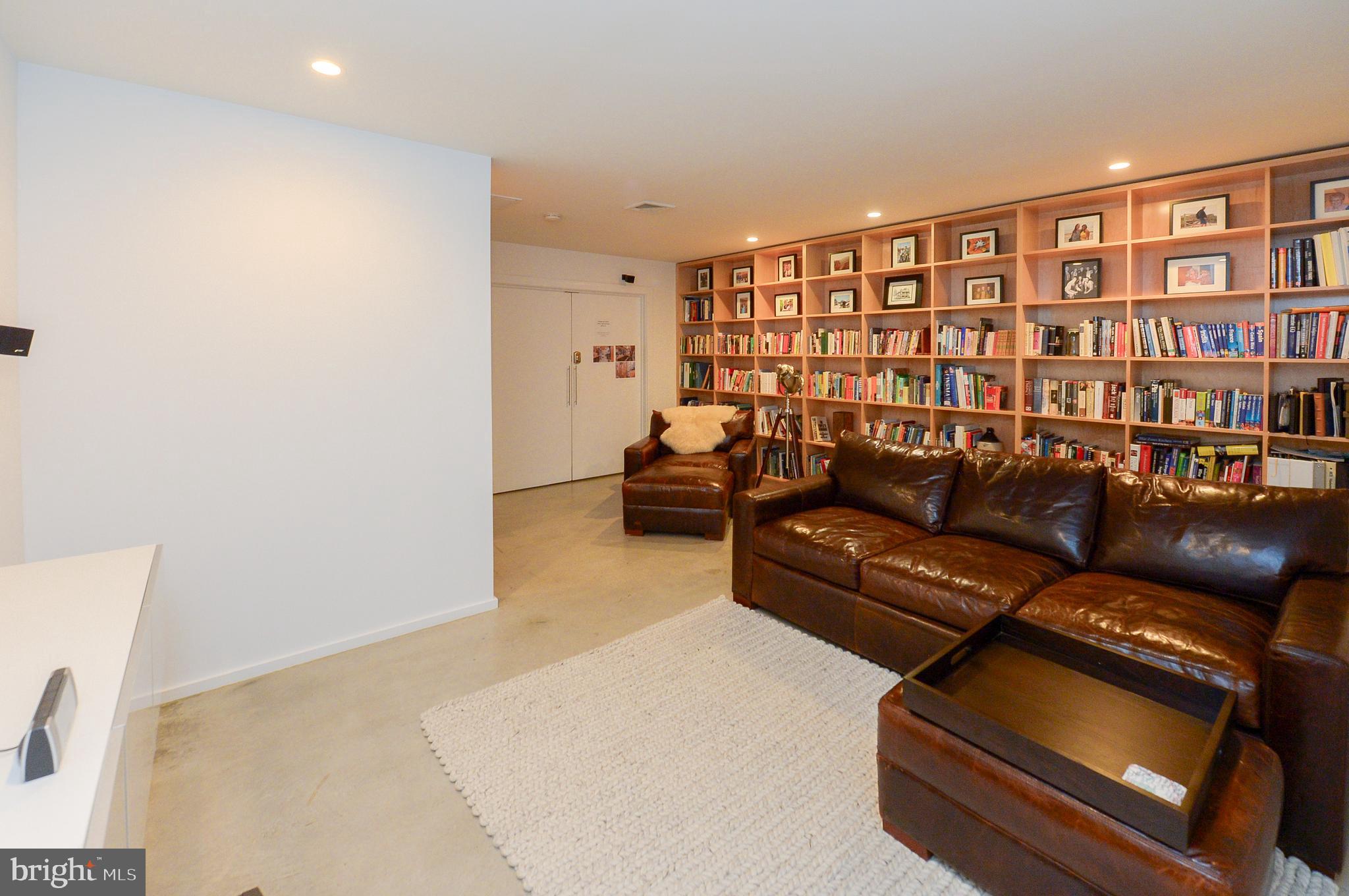 1119 North 3rd Street Philadelphia, PA 19123 - Photo 15 of 46 a living room with furniture and a book shelf