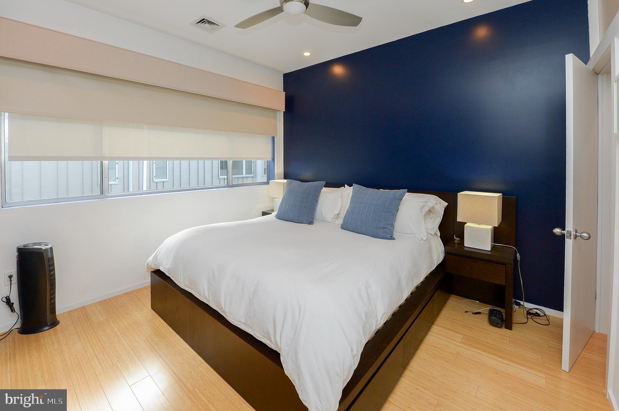 1119 North 3rd Street Philadelphia, PA 19123 - Photo 24 of 46 a bedroom with a bed and a chandelier