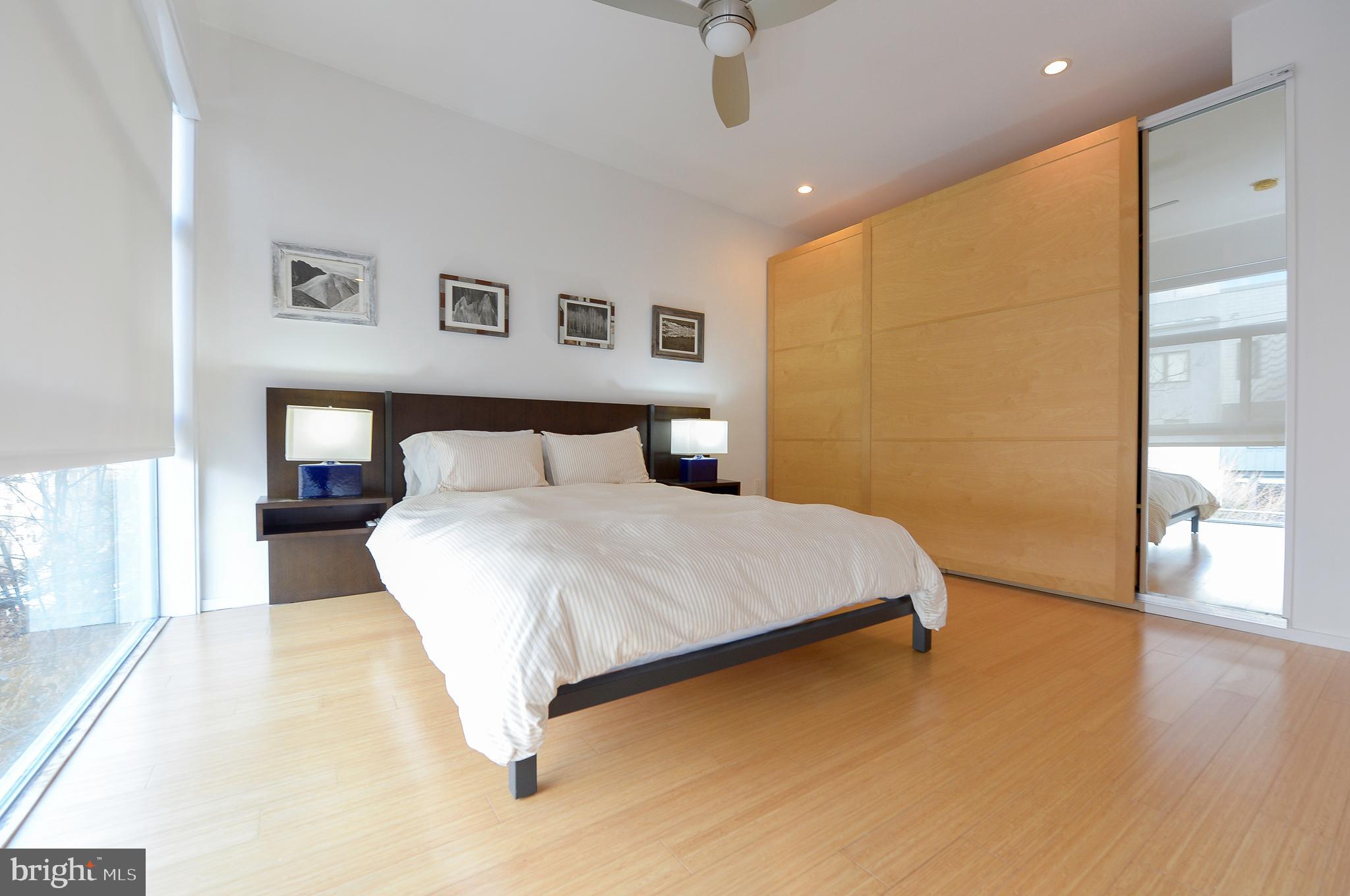 1119 North 3rd Street Philadelphia, PA 19123 - Photo 29 of 46 a bedroom with a bed and a night stand